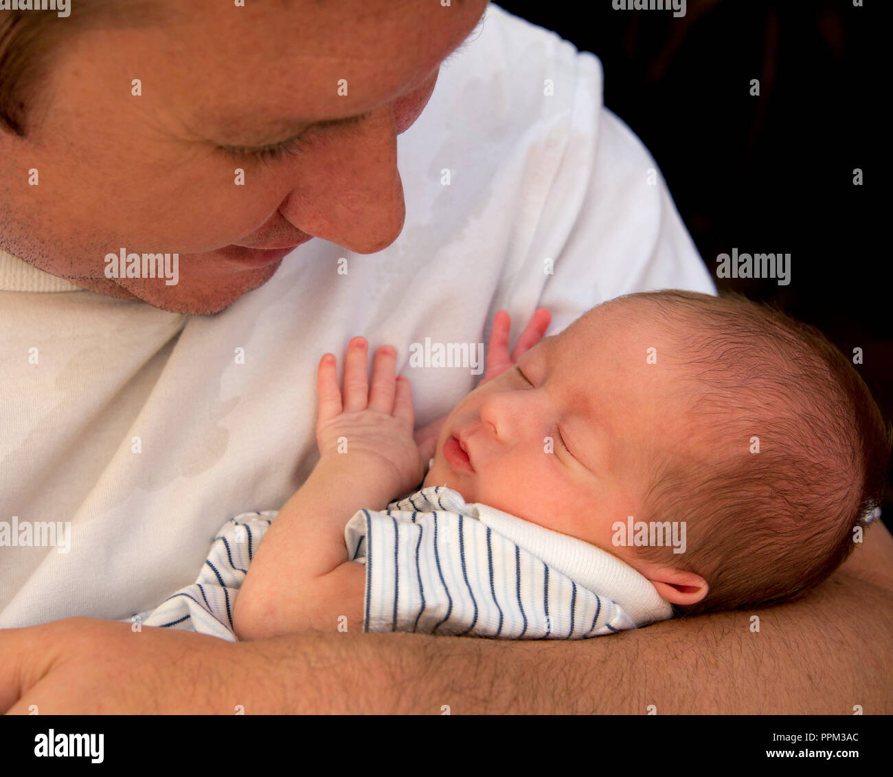 Horizontal portrait of a proud dad with his baby son. Stock Photo