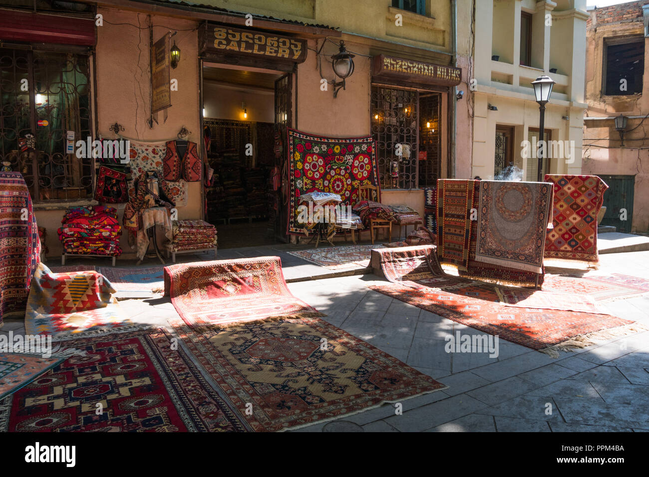 Rugs and carpets outside a gallery shop in Old Town, Tbilisi. Stock Photo