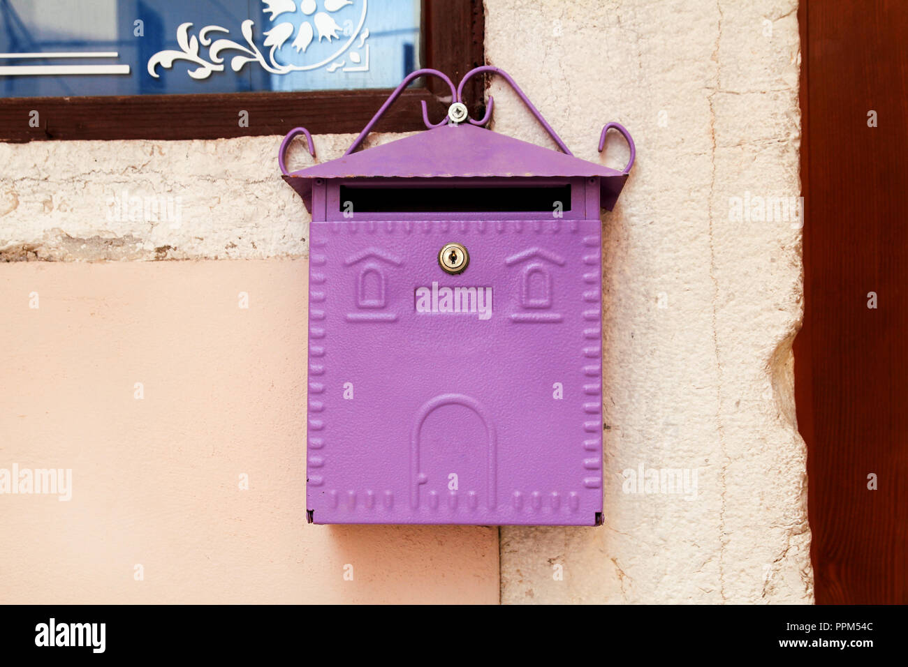 Mailbox. Purple home mailbox. Pink mailbox on Rovinj street, Croatia