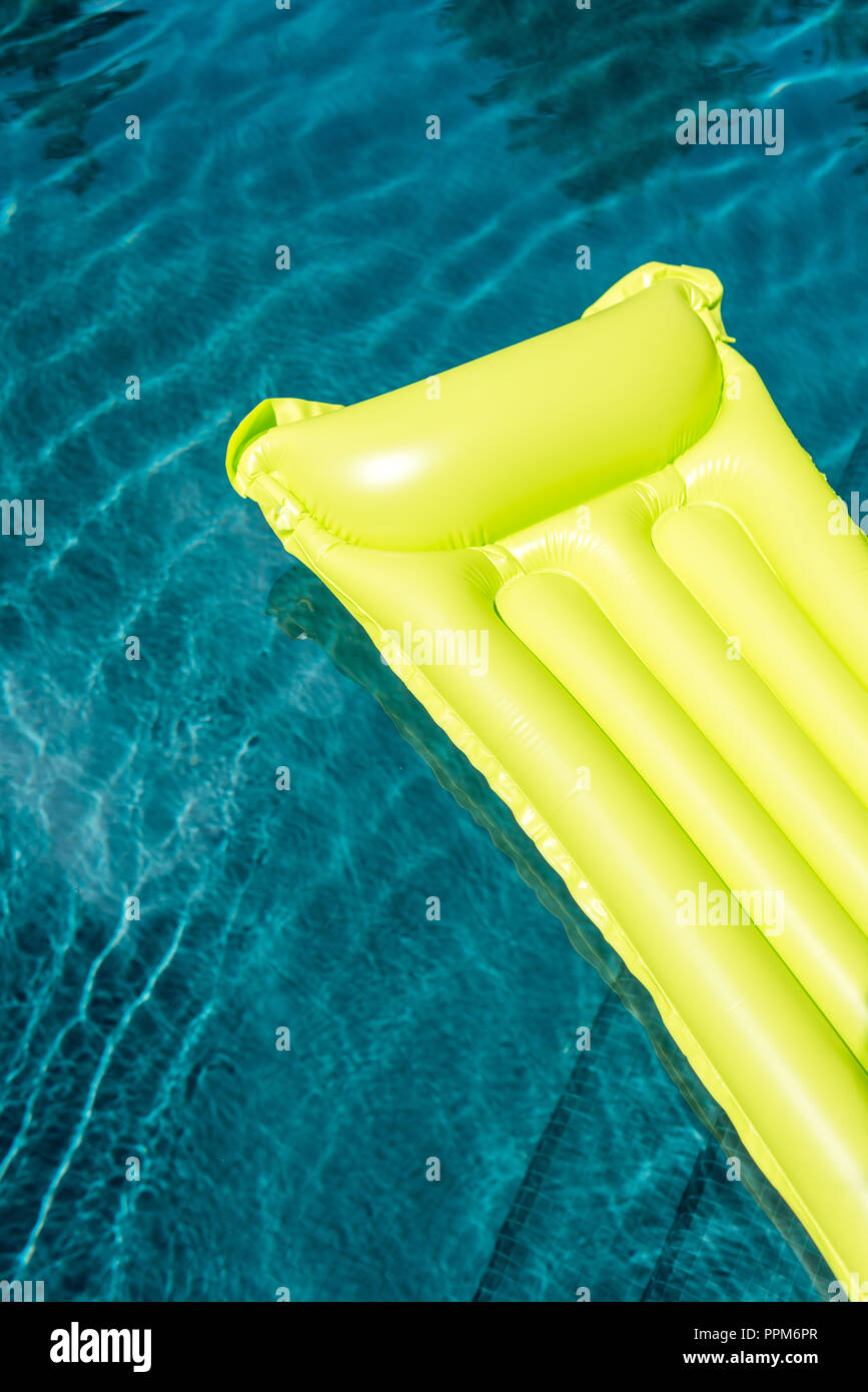 closeup shot of inflatable mattress floating in swimming pool Stock