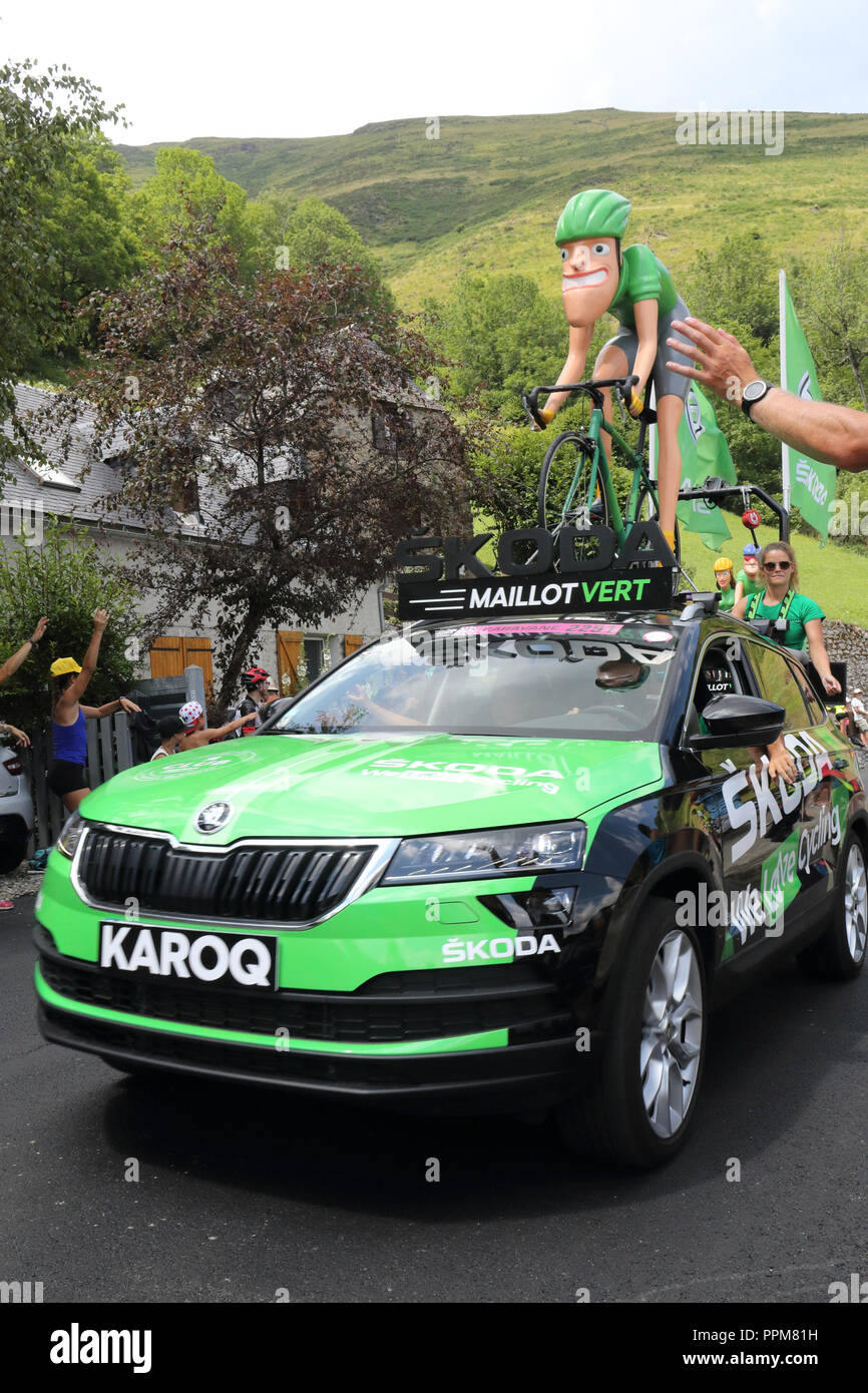 The Green jersey (maillot vert) car sponsor during the 2018 Tour de France 17th stage in Soulan, French Pyrenees, and supporters on the roadside. Stock Photo