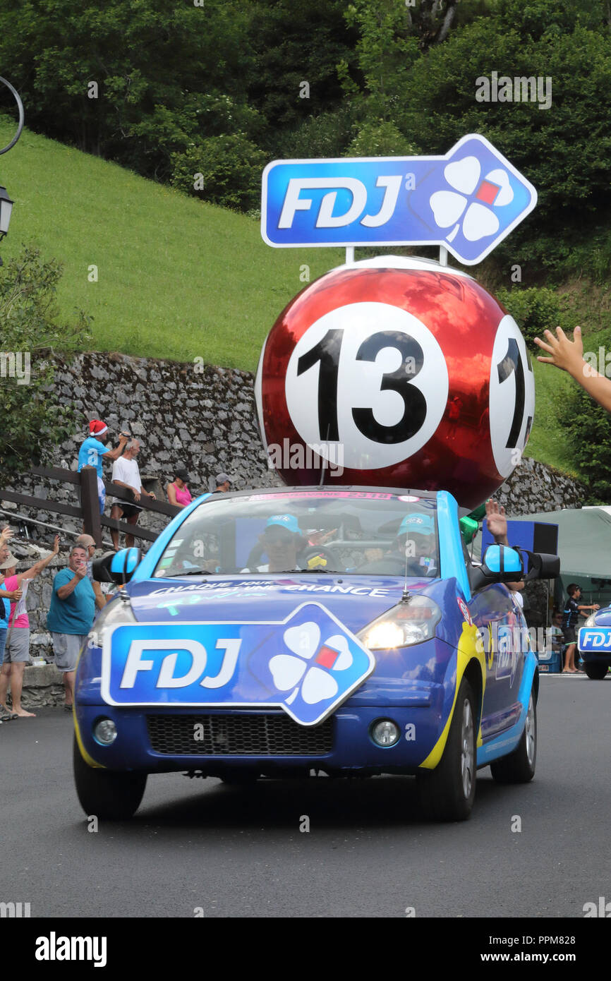 The Française des Jeux cars throwing free gifts during the 2018 Tour de France 17th stage in Soulan, in the French Pyrenees. Stock Photo