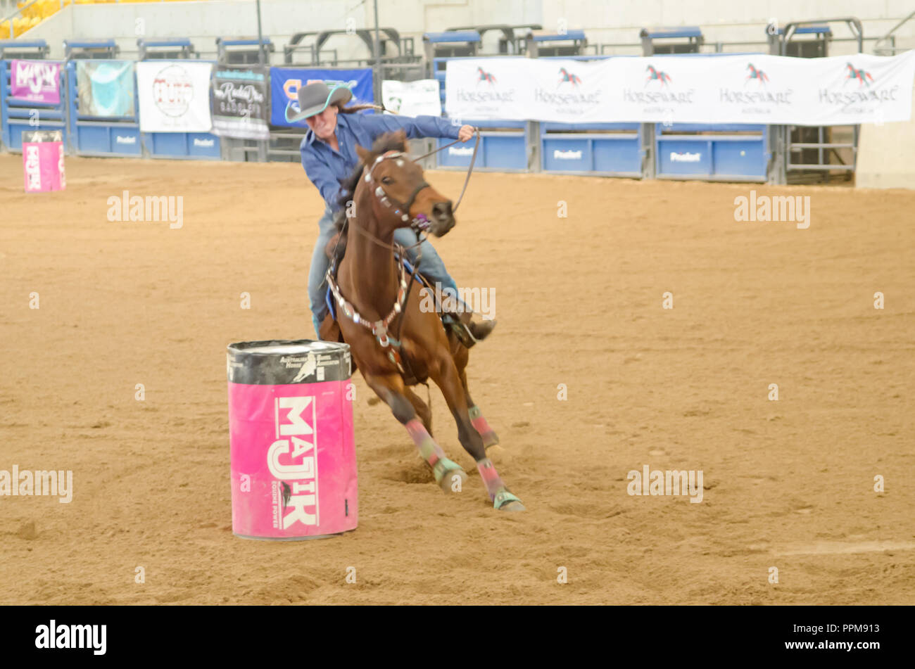 Rider desperately trying to steer horse away from the barrel to avoid a penalty. Tamworth NSW Australia. Stock Photo