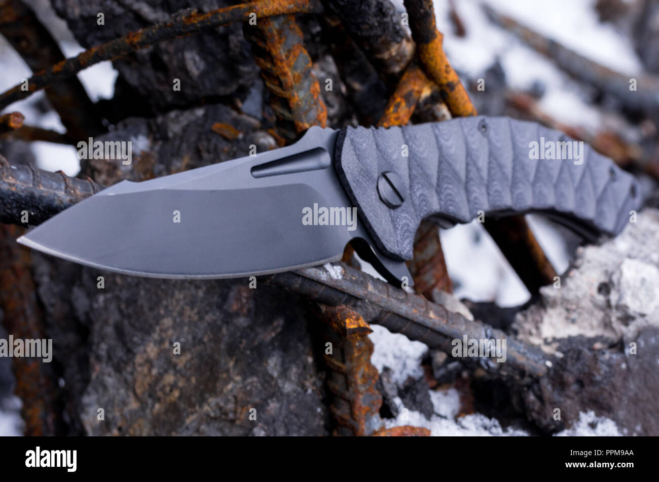 Photo knife in a tight. Wide blade of knife Stock Photo Alamy