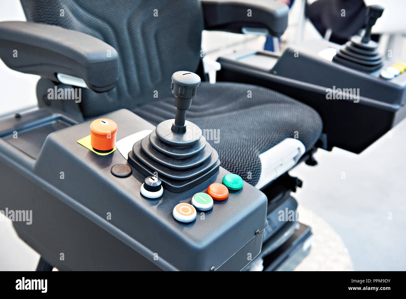 Joystick on driver seat for construction vehicle Stock Photo