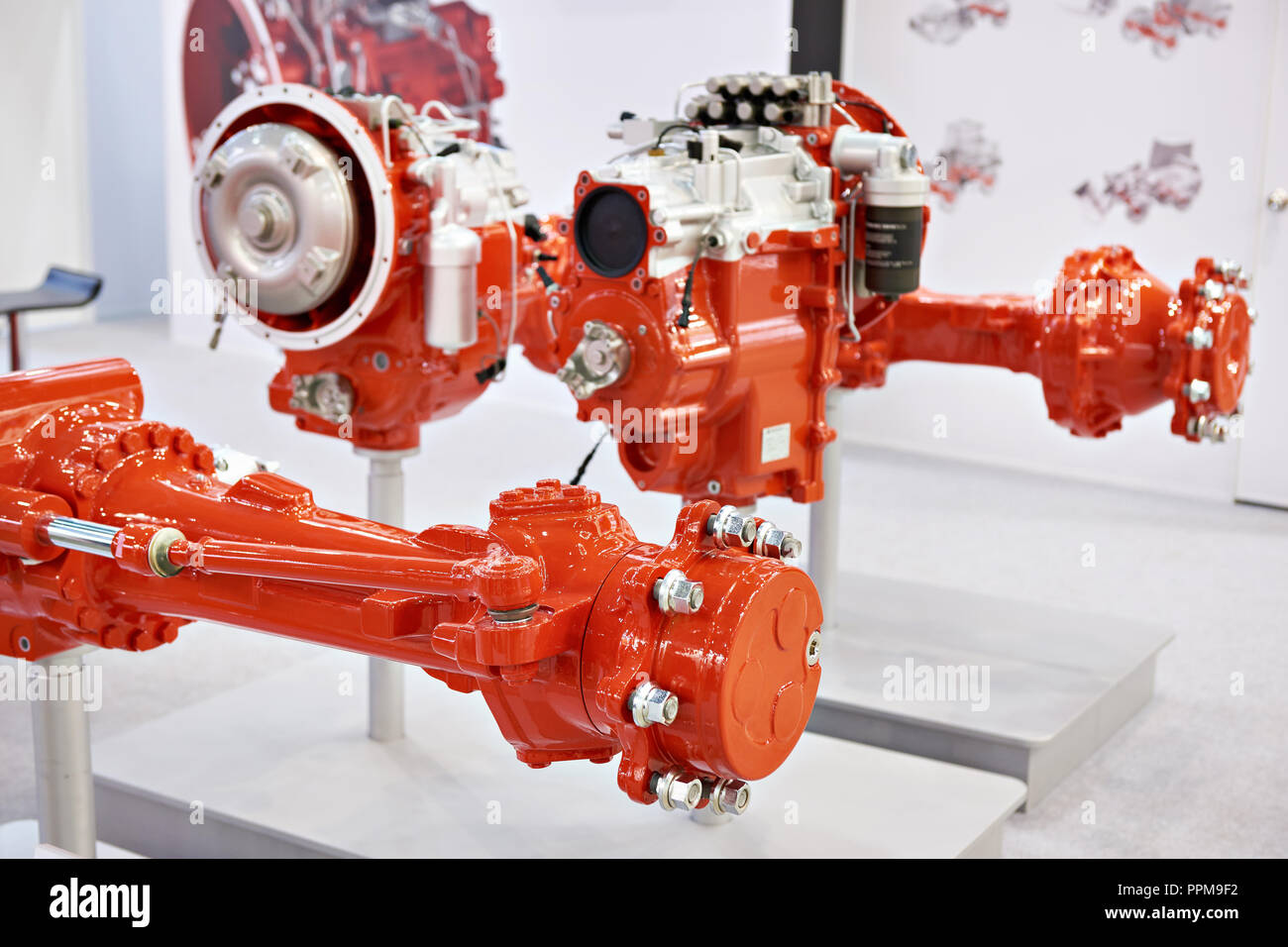 Front and rear axles for backhoe loaders and transmission systems Stock