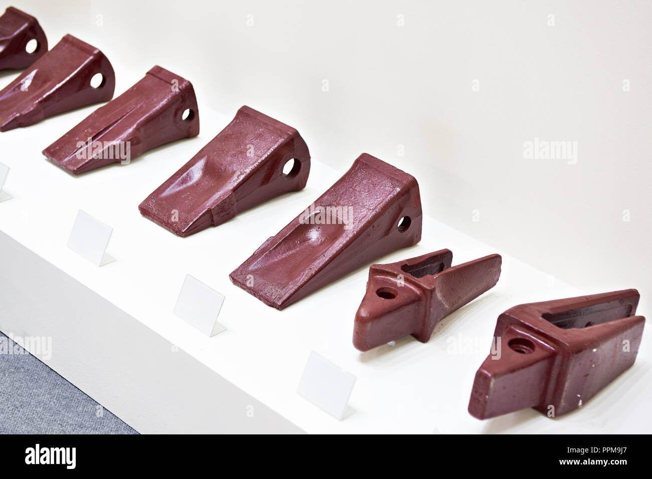 Bucket crowns for excavator bucket in showcase on store Stock Photo Alamy