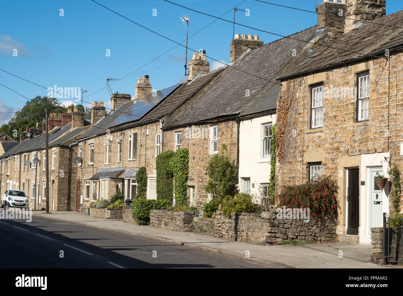 Row of stone built terraced houses in Front Street, Frosterley, Co. Durham, England, UK Stock Photo