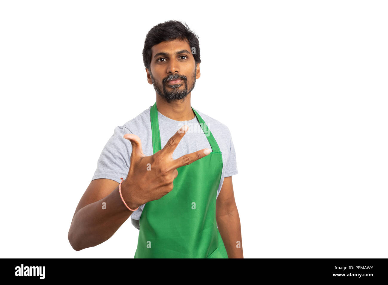 Indian supermarket or hypermarket employee holding fingers up and showing number three isolated