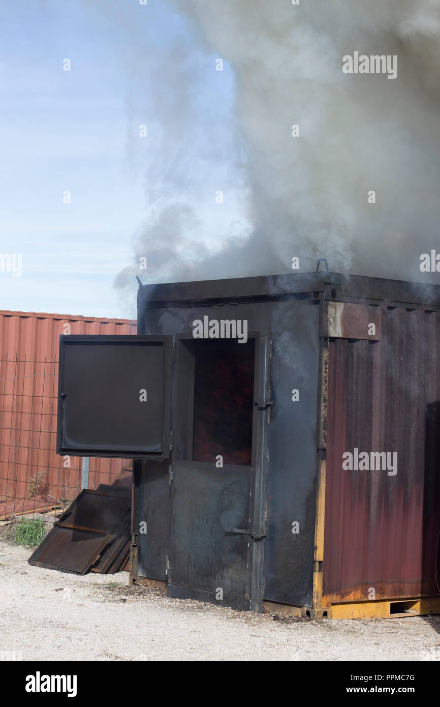 Firefighter putting out fire training station extinguisher backdraft ...