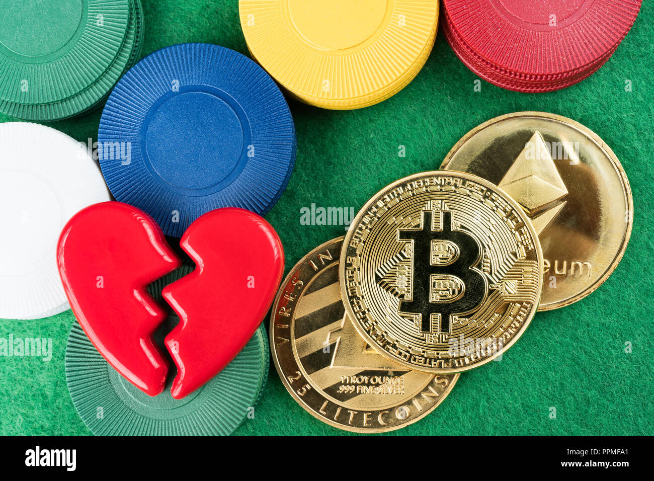 Casino chips and bitcoin on green table, cryptocurrency gambling concept  Stock Photo - Alamy