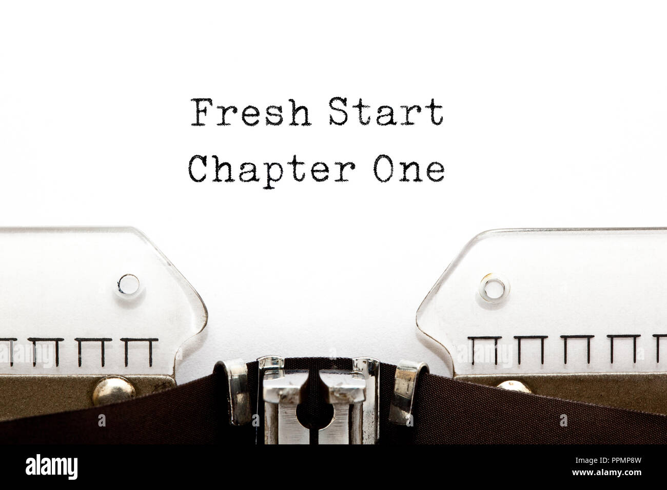 Motivational slogan Fresh Start Chapter One typed on vintage typewriter. Stock Photo