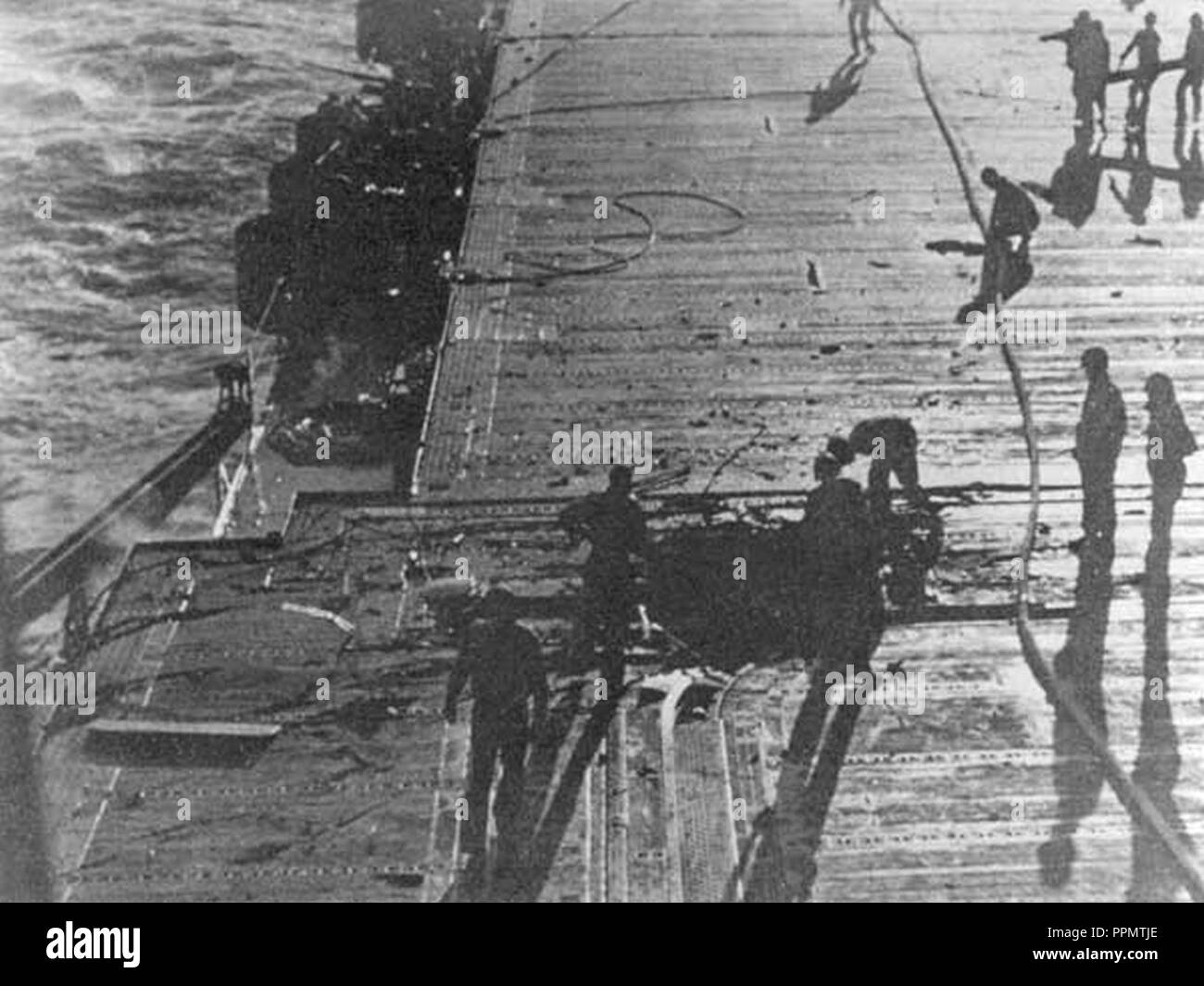 Bomb damage on flight deck of USS Enterprise (CV-6) on 24 August 1942. Stock Photo
