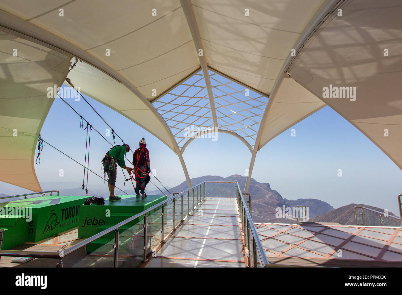 Ras Al Khaimah, Ras Al Khaimah, United Arab Emirates. 20th Mar, 2018. People seen using the zipline.The World's Longest Zipline certified by Guinness World Records, with 2.83km span of zipwire, equivalent to 28 football pitches is located in the Jabal Jais Mountains in Ras Al Khaimah. Starting at the highest point of the UAE (1,680mts above the sea level) and after flying at an average speed of 120kph, one will land on a clear suspended platform. Credit: Mike Hook/SOPA Images/ZUMA Wire/Alamy Live News Stock Photo