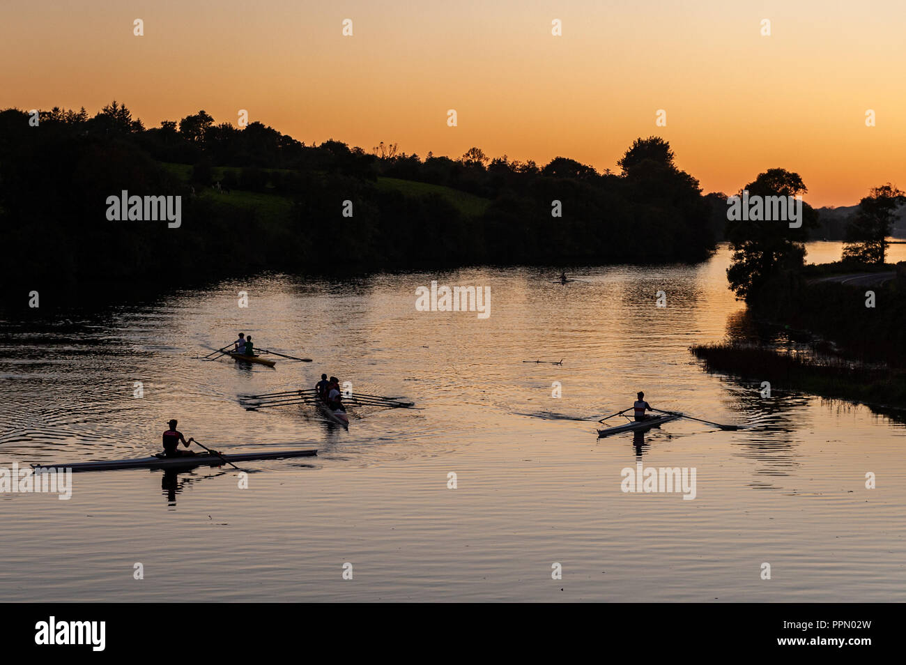 Skibbereen, West Cork, Ireland. 26th Sept, 2018. Young rowers from Skibbereen Rowing Club undertake a training session on the River Ilen at the end of a day of sunshine in West Cork.  Credit: Andy Gibson/Alamy Live News. Stock Photo