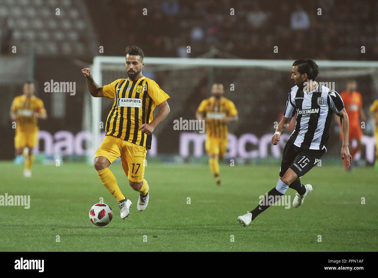 Thessaloniki, Greece. 26th Sep, 2018. PAOK's Jose Angel Crespo (Right) duels for the ball with ARIS's Bruno Alexandre Vilela Gama (Left) during a Cup match between PAOK and ARIS. Greek Football Cup game between PAOK FC and ARIS FC, with the game ending with a score of 1-1. Credit: Giannis Papanikos/ZUMA Wire/Alamy Live News Stock Photo