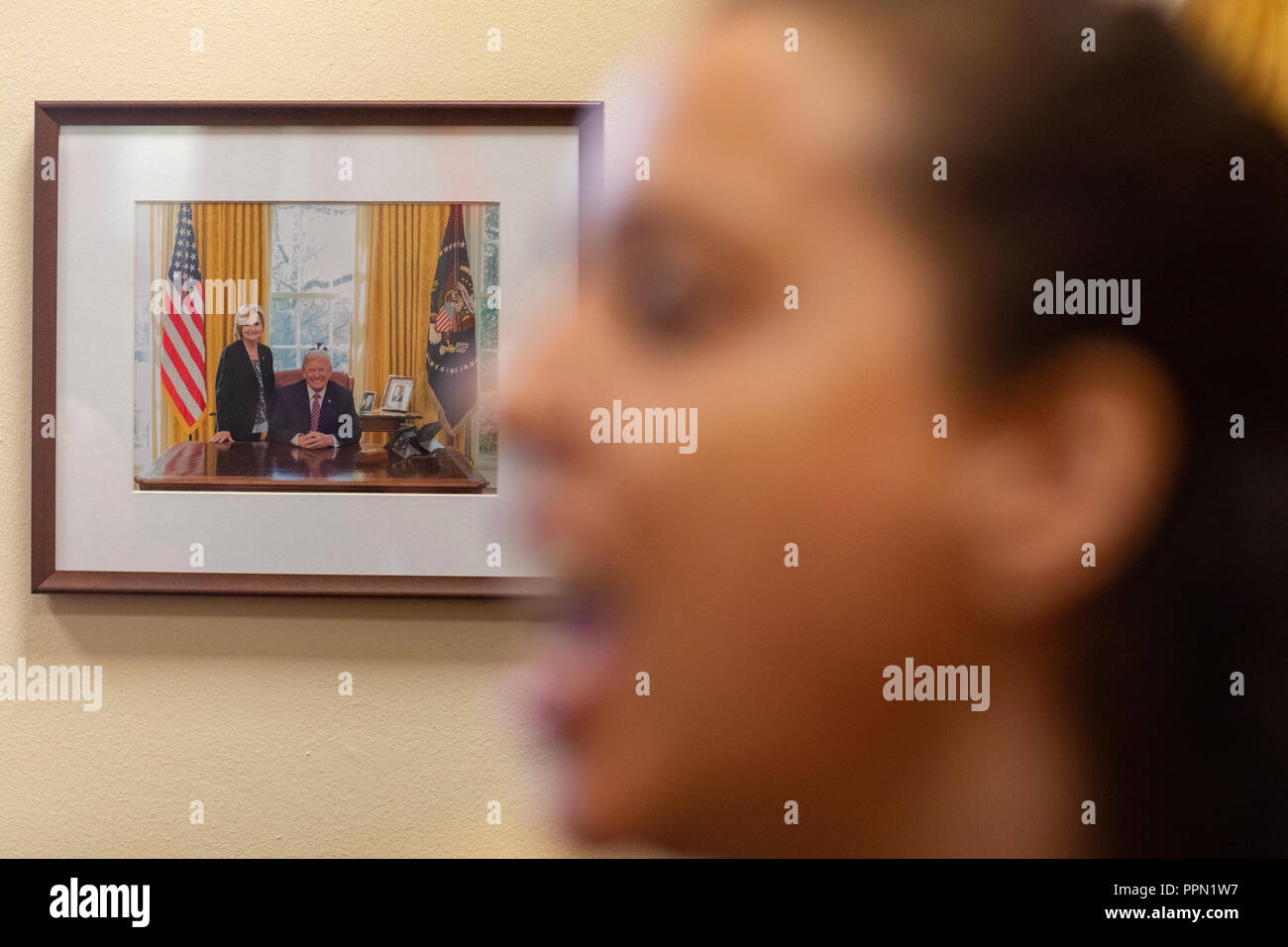 A woman shouts while demonstrating in the office of Senator Cindy Hyde-Smith, Republican of Mississippi, on Capitol Hill in Washington, DC on September 26, 2018. The demonstrators are protesting against the nomination of Judge Brett Kavanaugh to be a Supreme Court Associate Justice. Credit: Alex Edelman/CNP | usage worldwide Stock Photo