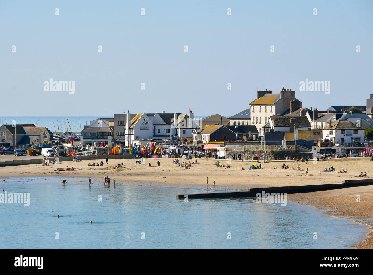 Lyme Regis, Dorset, UK.  27th September 2018. UK Weather.   The beach and seafront at the seaside resort of Lyme Regis in Dorset on a day of clear blue skies and warm sunshine before temperatures fall tomorrow as a cold front passes over.  Picture Credit: Graham Hunt/Alamy Live News Stock Photo