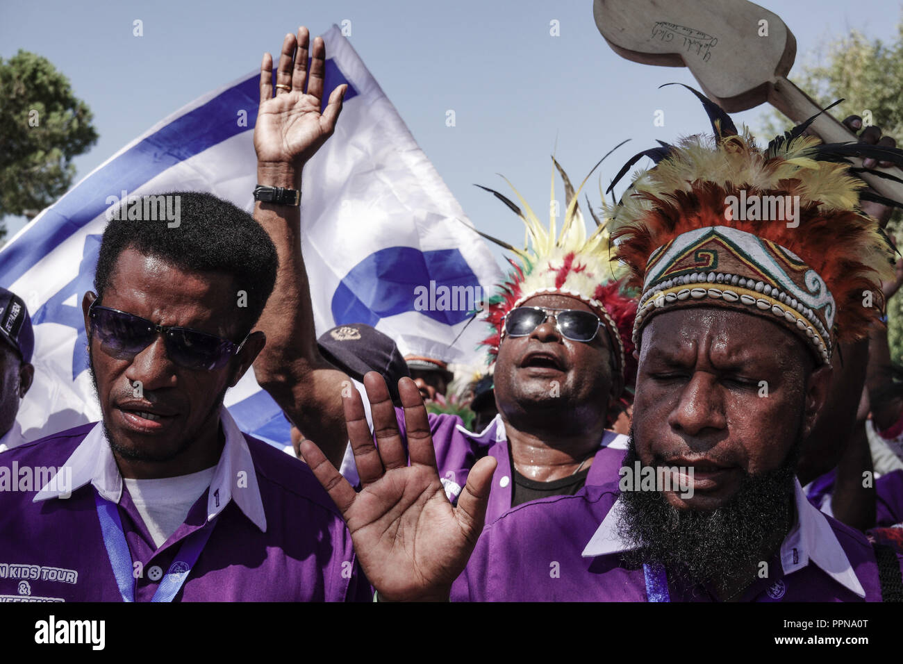 Jerusalem, Israel. 27th September, 2018. Members of the Papua New Guinea delegation rejoice with tens of thousands who marched in the annual Jerusalem Parade including delegations from around the world, Israeli industry, banks, emergency and military personnel, in the tradition of Temple Mount pilgrimages on the holiday of Sukkot and in a show of international support for Israel. Credit: Nir Alon/Alamy Live News Stock Photo