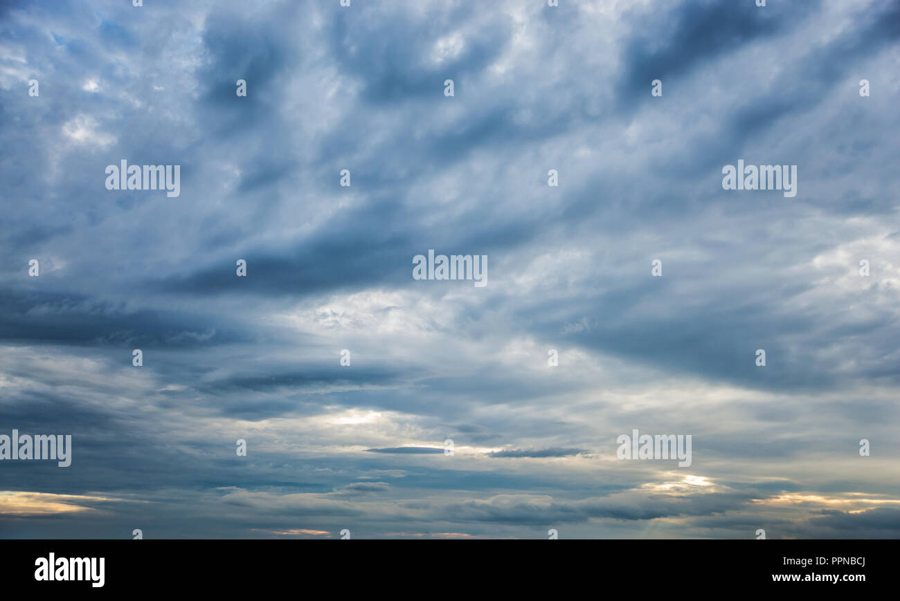 Background of dramatic sky with dark clouds before a thunder-storm ...