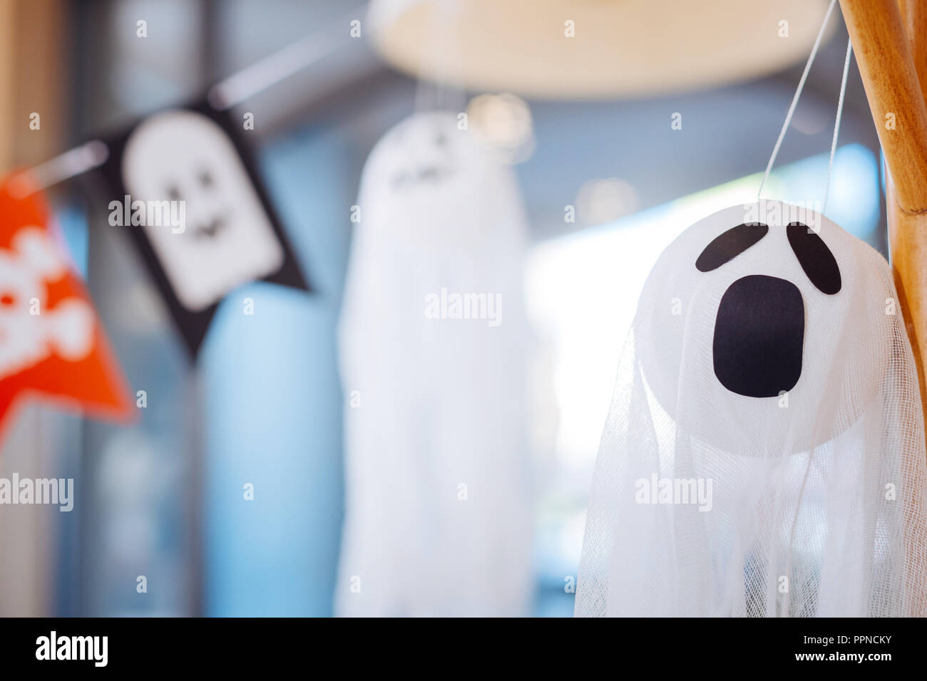 Close up of scary white ghost used as Halloween decoration for children party Stock Photo