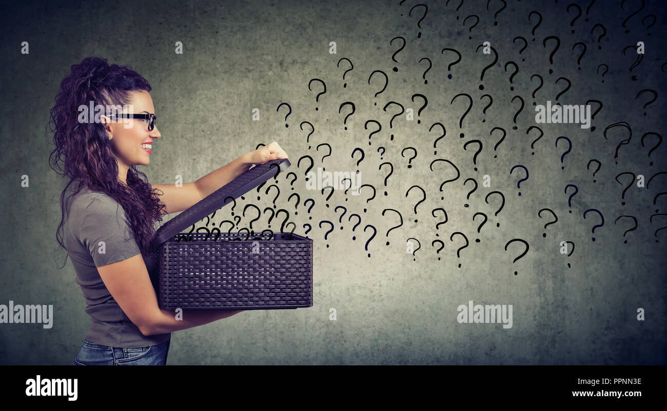 Happy woman with many questions looking for an answer Stock Photo