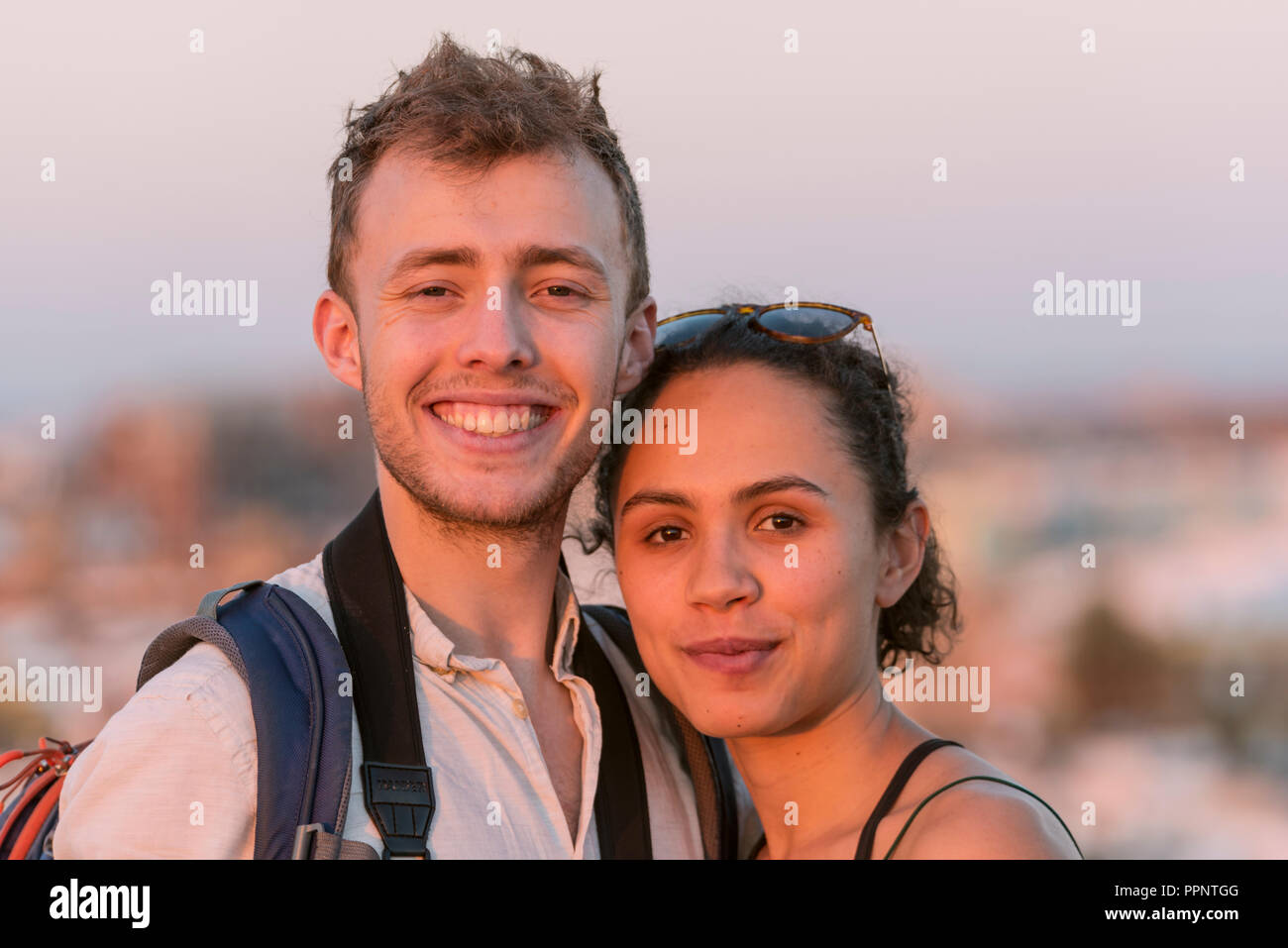Laughing young woman and young man looking into the camera, couple, Plaza de la Encarnacion, Seville, Andalusia, Spain Stock Photo