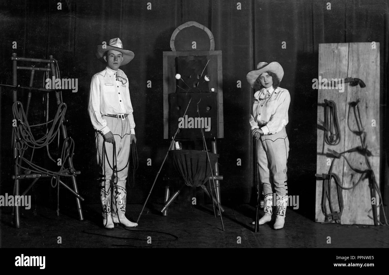 Artist, stage, knife thrower and whip artist with partner, dressed as cowboy, 1910s, Germany Stock Photo