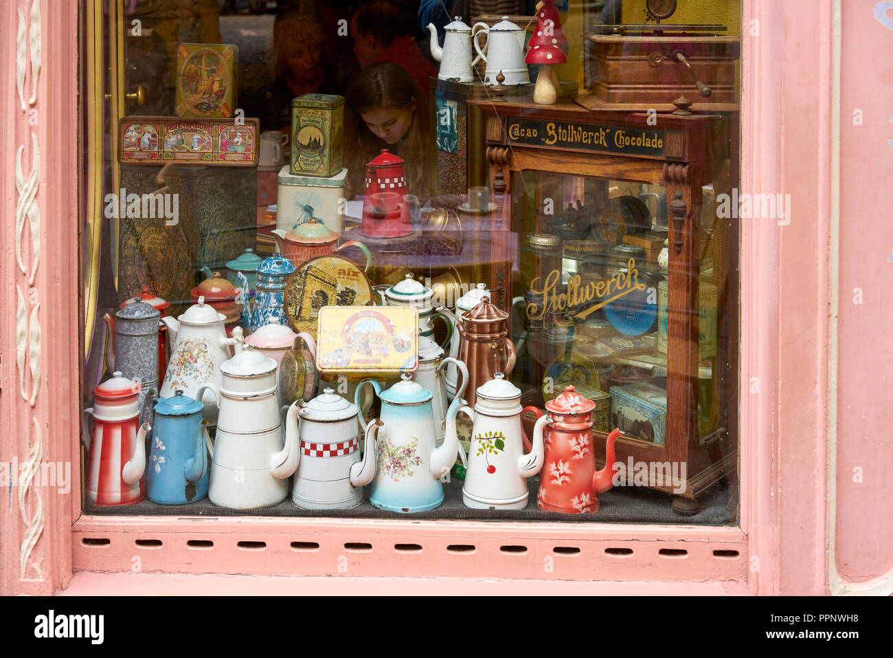 Historic coffee pots in shop window of a cafe in Colmar, Alsace, France