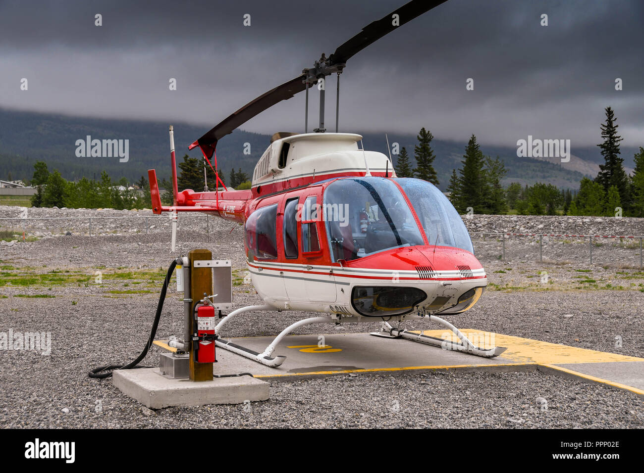 CANMORE, ALBERTA, CANADA - JUNE 2018: Bell 206 Longranger helicopter operated by Alpine Helicopters from its base in Canmore, Stock Photo