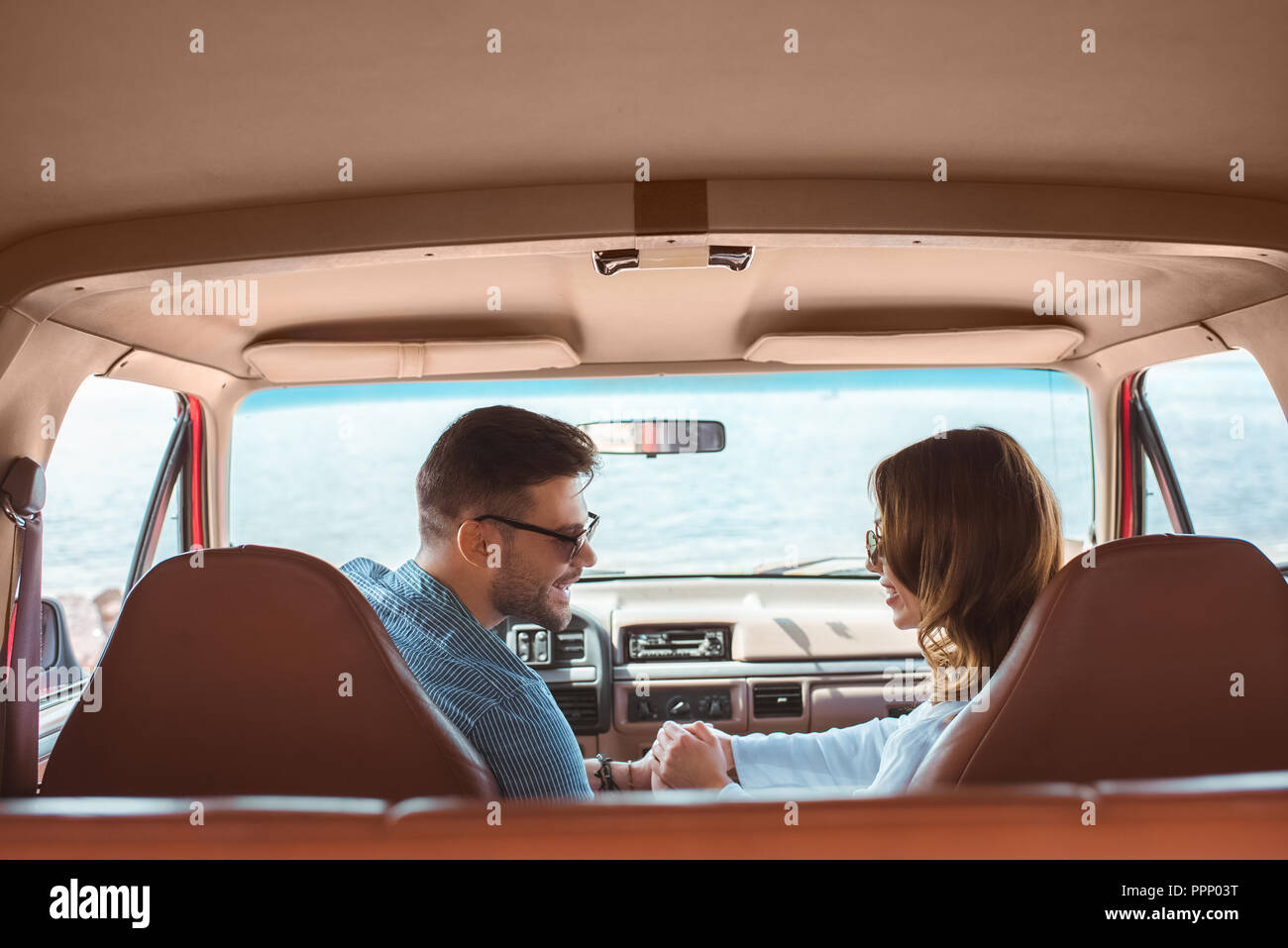 Happy couple sitting in car hi-res stock photography and images - Alamy