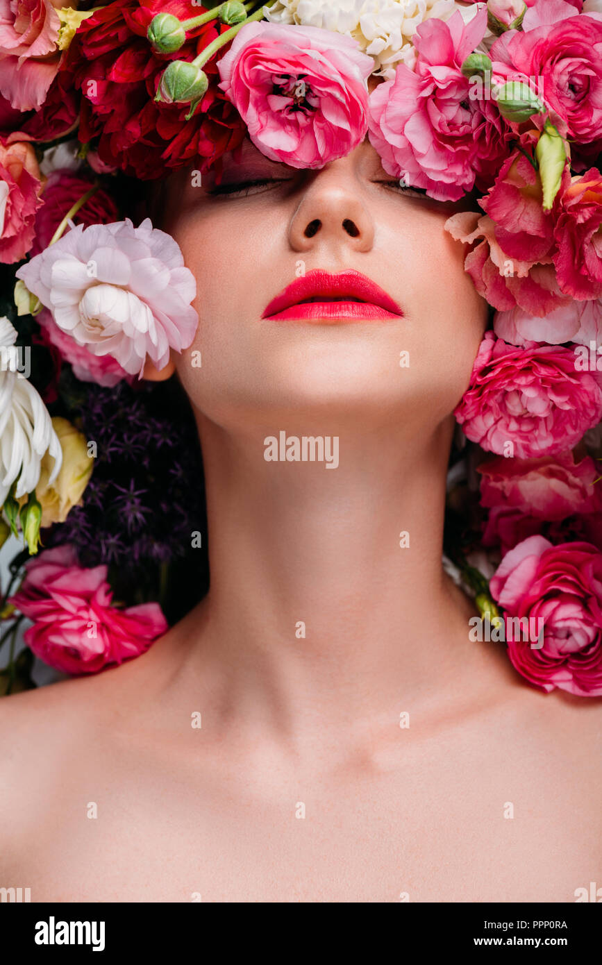 portrait of gorgeous young woman with closed eyes and beautiful flowers ...