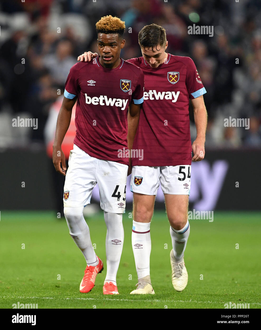 West Ham United's Grady Diangana (left) and Joe Powell  during the Carabao Cup, Third Round match at London Stadium. PRESS ASSOCIATION Photo. Picture date: Wednesday September 26, 2018. See PA story SOCCER West Ham. Photo credit should read: Joe Giddens/PA Wire. RESTRICTIONS: EDITORIAL USE ONLY No use with unauthorised audio, video, data, fixture lists, club/league logos or 'live' services. Online in-match use limited to 120 images, no video emulation. No use in betting, games or single club/league/player publications. Stock Photo