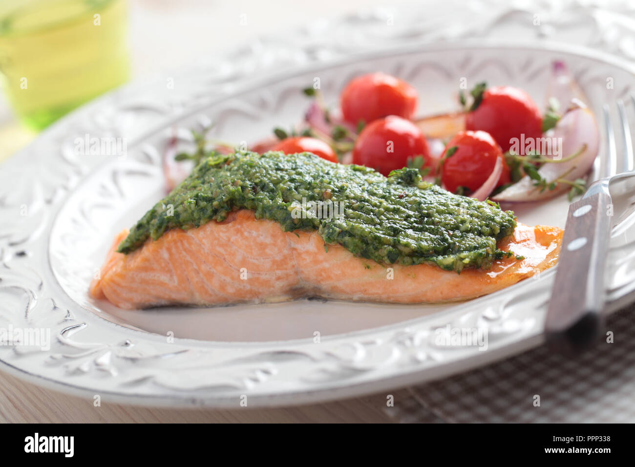 Baked salmon with pesto and vegetables Stock Photo Alamy