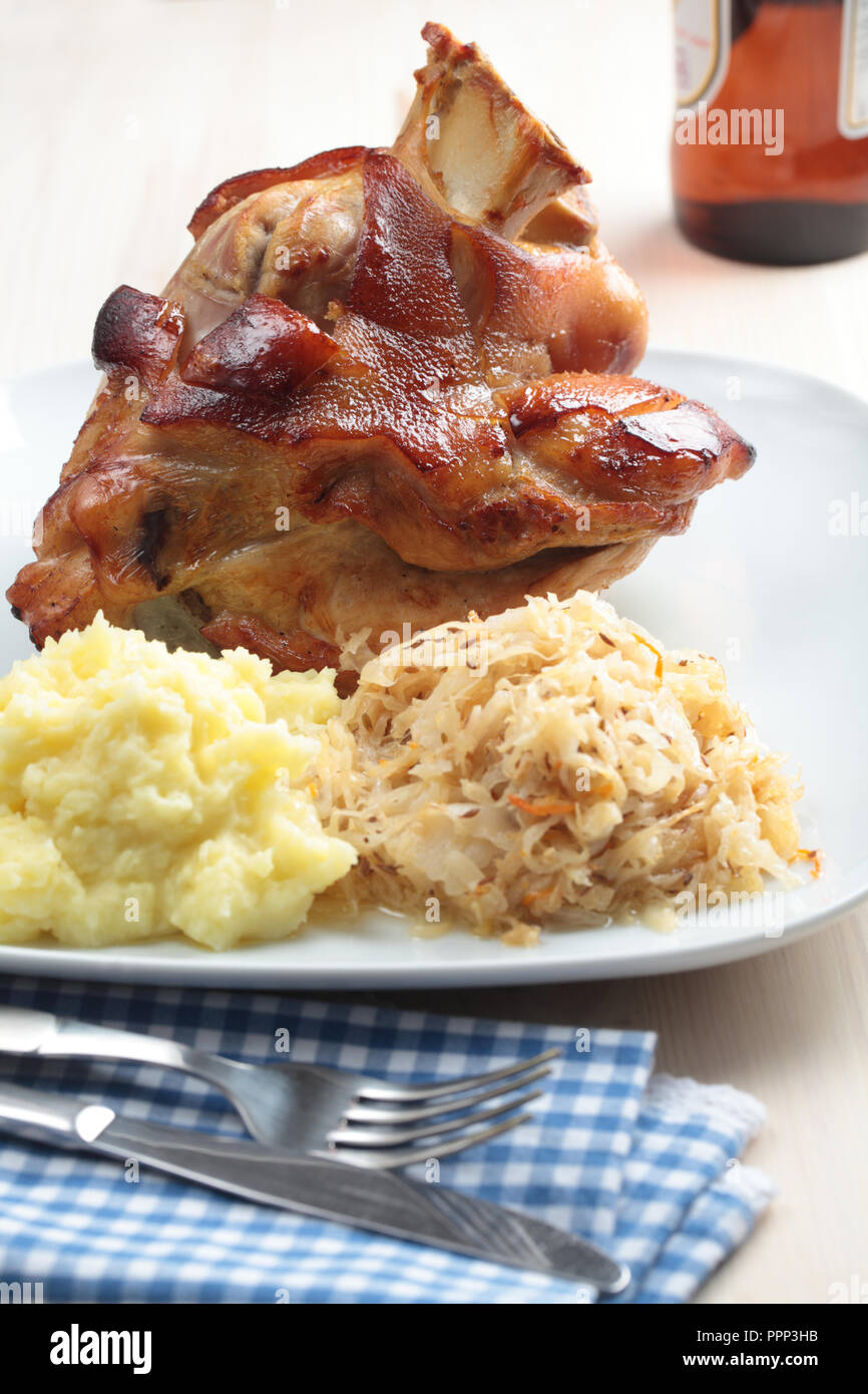 Roasted pork knuckle with mashed potato and braised sauerkraut Stock