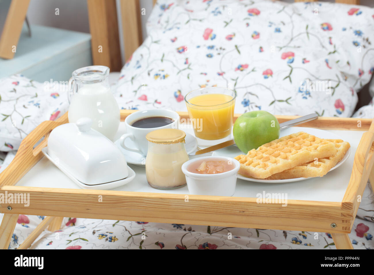 Tray with breakfast on a bed Stock Photo - Alamy