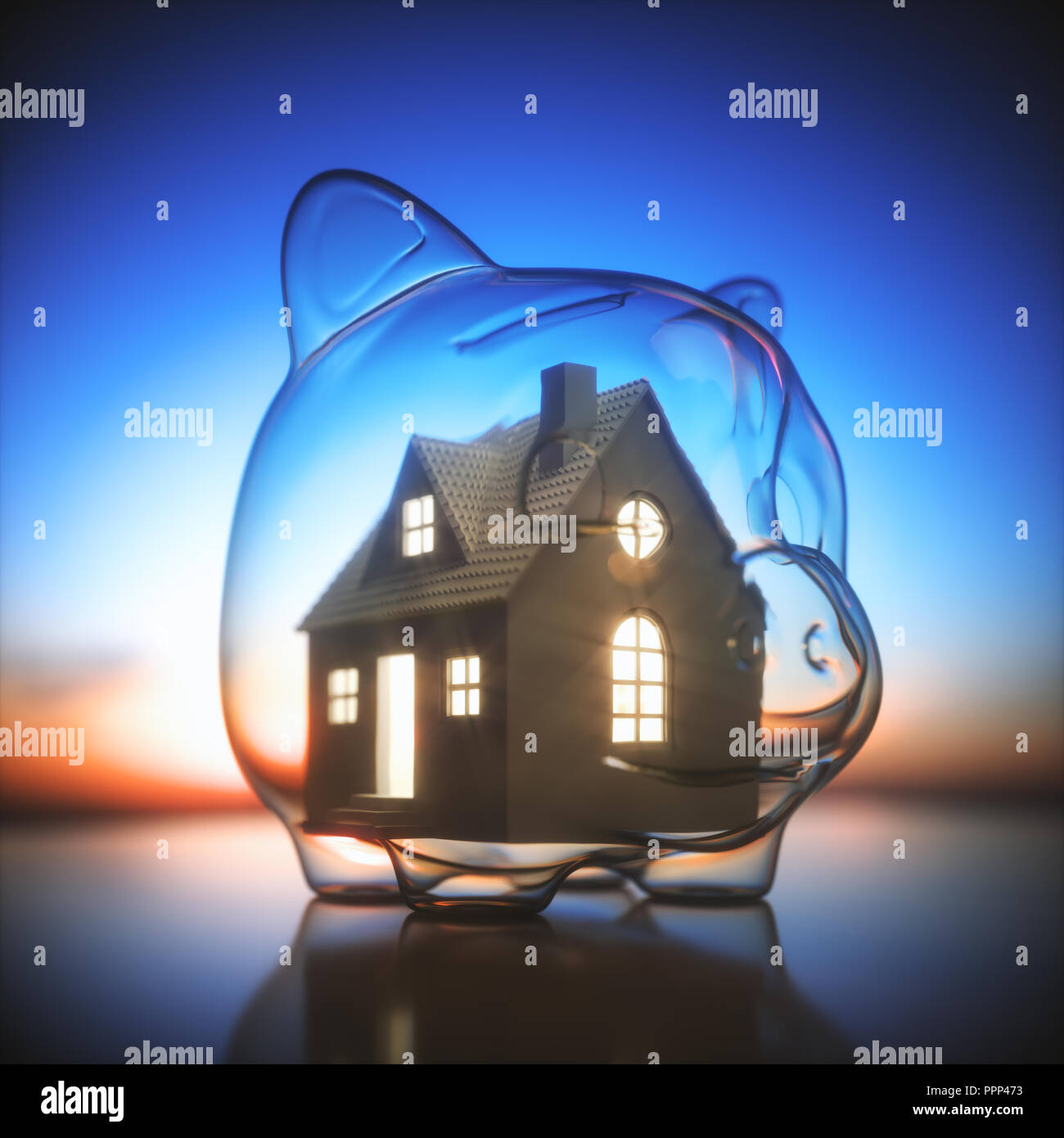 Piggy bank of glass, with a miniature house lit inside. Concept of saving money for the purchase of a new house. Stock Photo