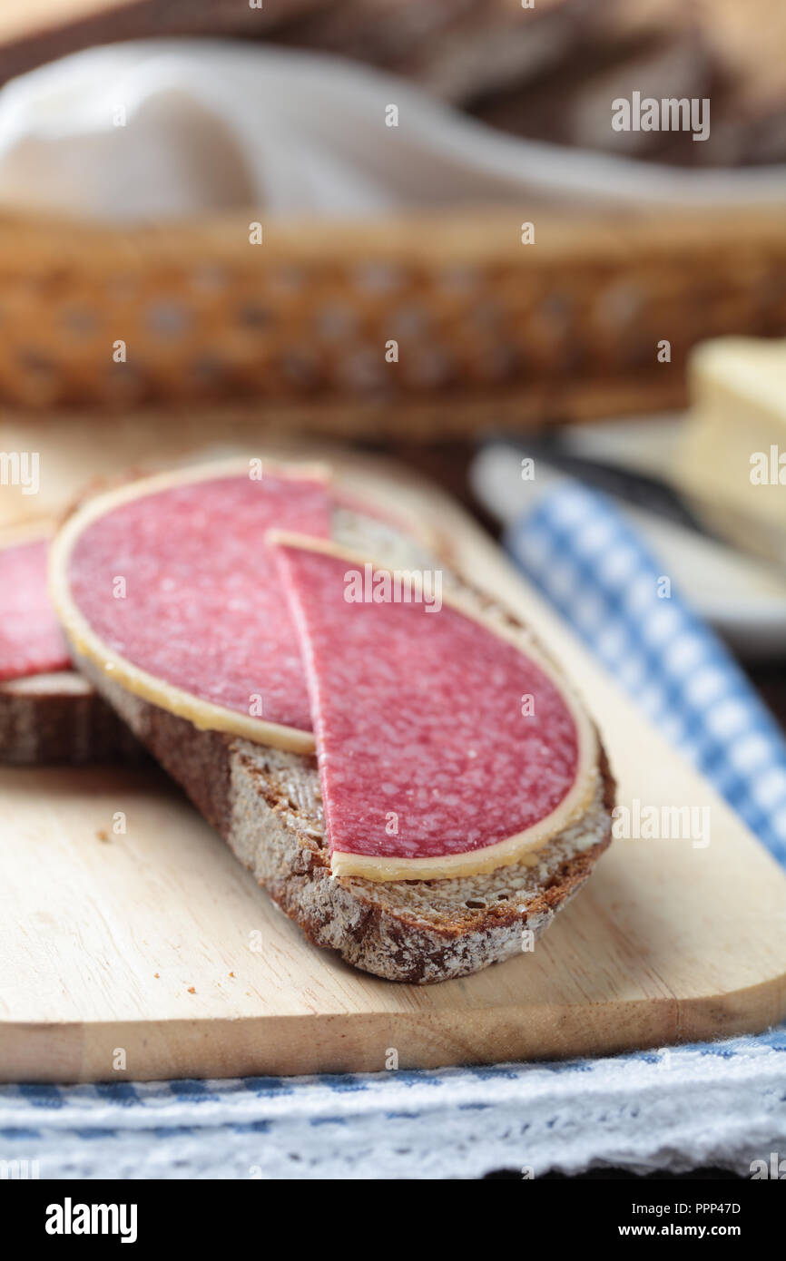 Open sandwiches with Parmesan German salami and butter Stock Photo Alamy