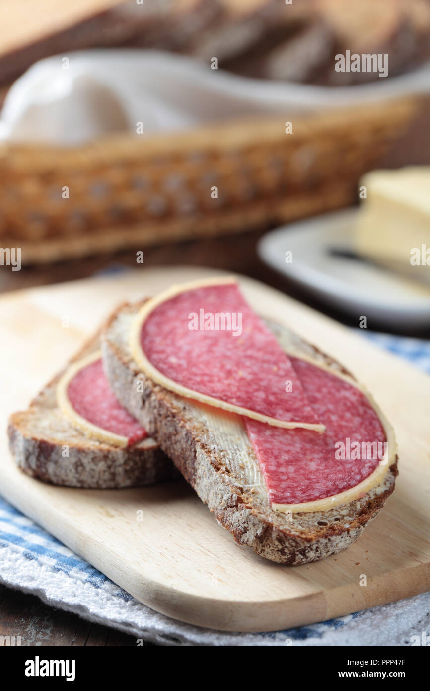Open sandwiches with Parmesan German salami and butter Stock Photo Alamy