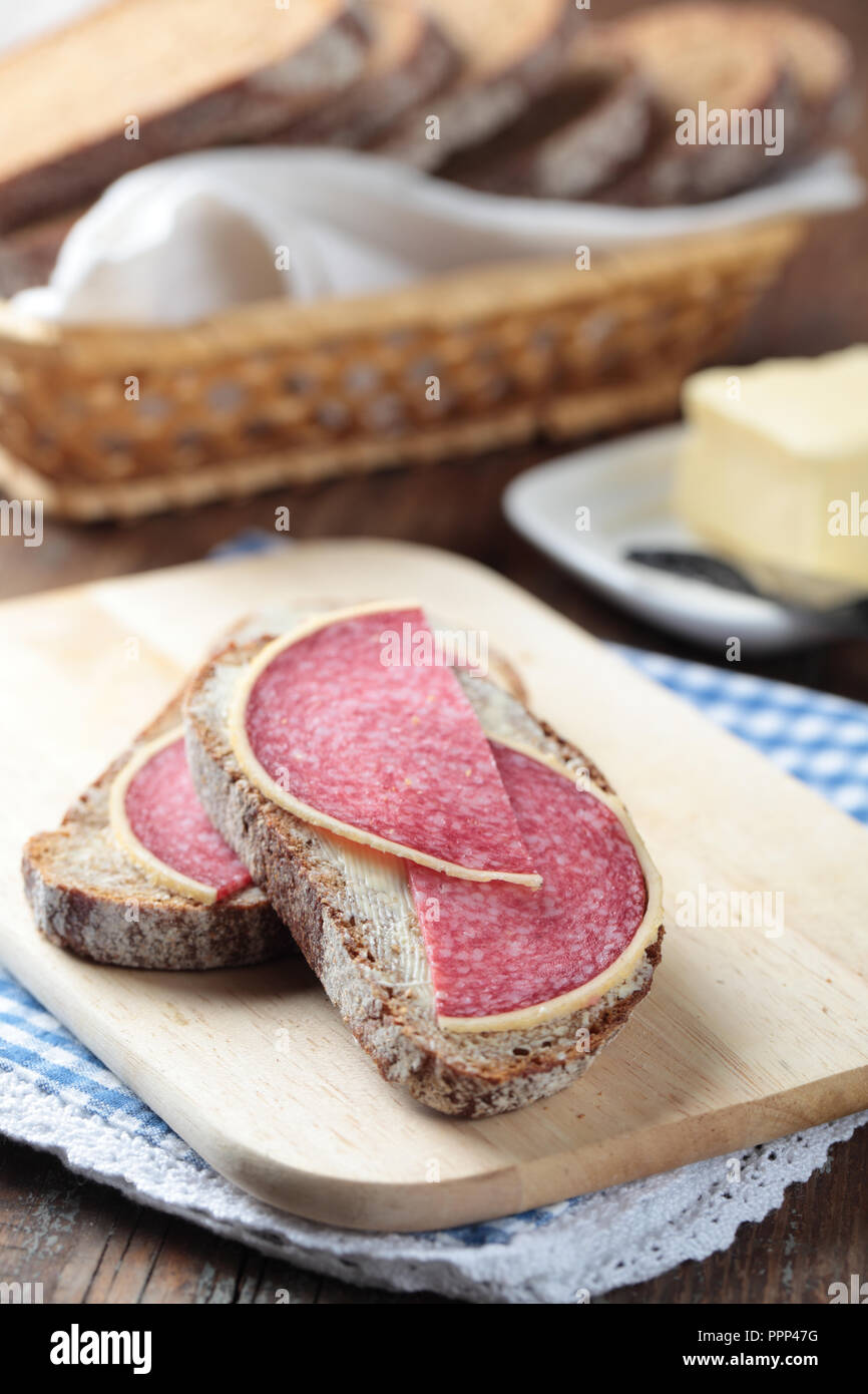 Open sandwiches with Parmesan German salami and butter Stock Photo