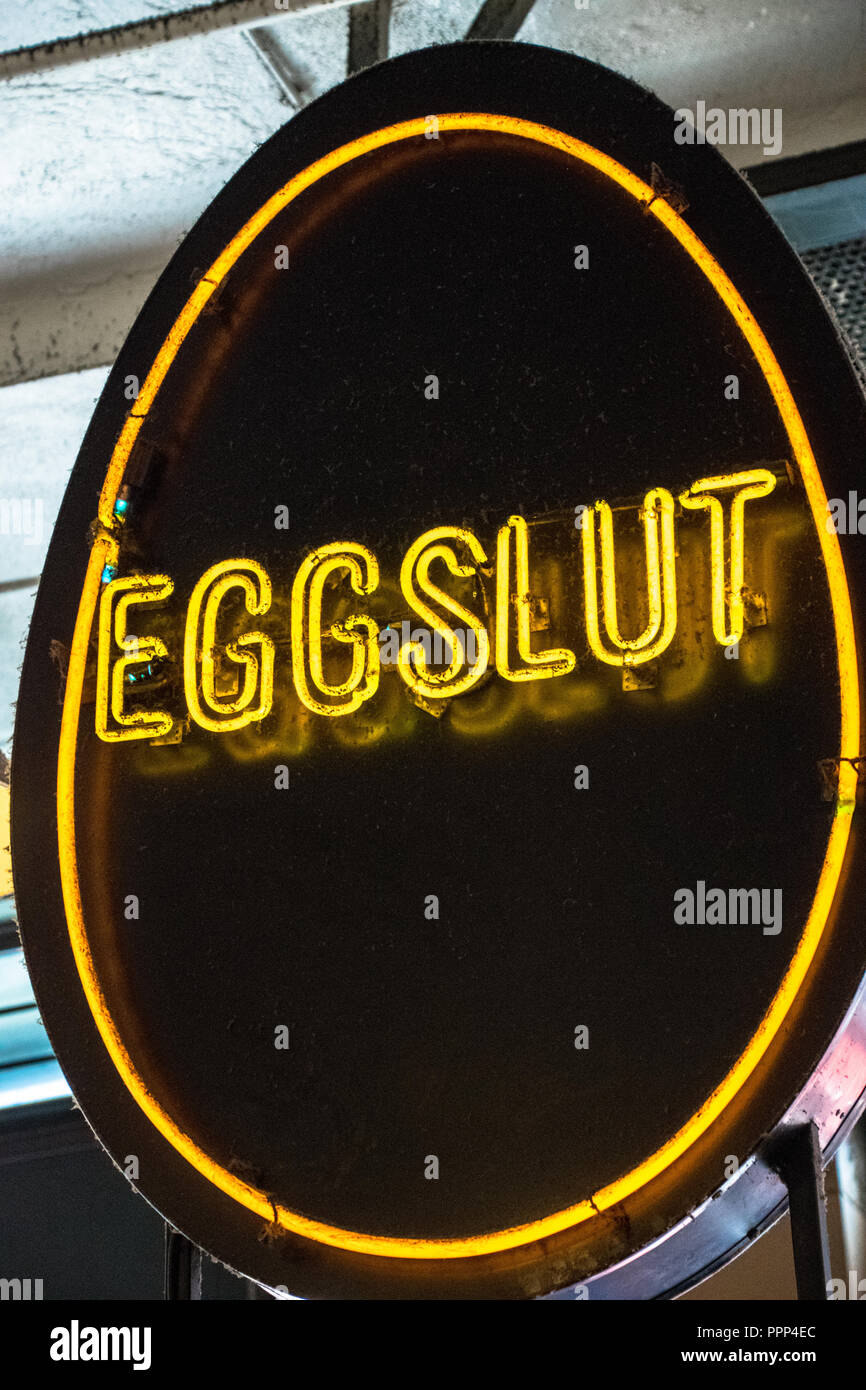 Neon sign for the "Eggslut" eatery inside the Central Market in