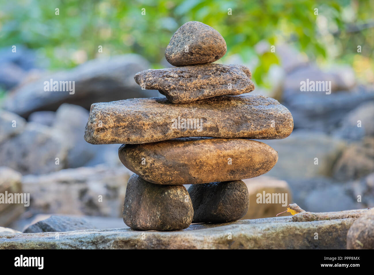 A traditional Inuit method of creating a man made marker in areas of few natural landmarks, the inuksuk has become a national symbol of Canada. Stock Photo