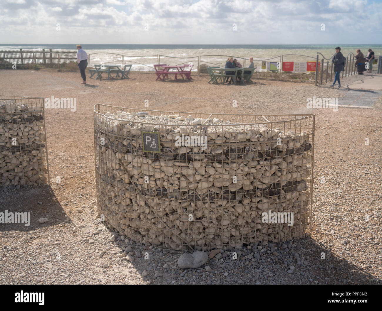 Parking space for disabled driver built from beach pebbles Stock Photo