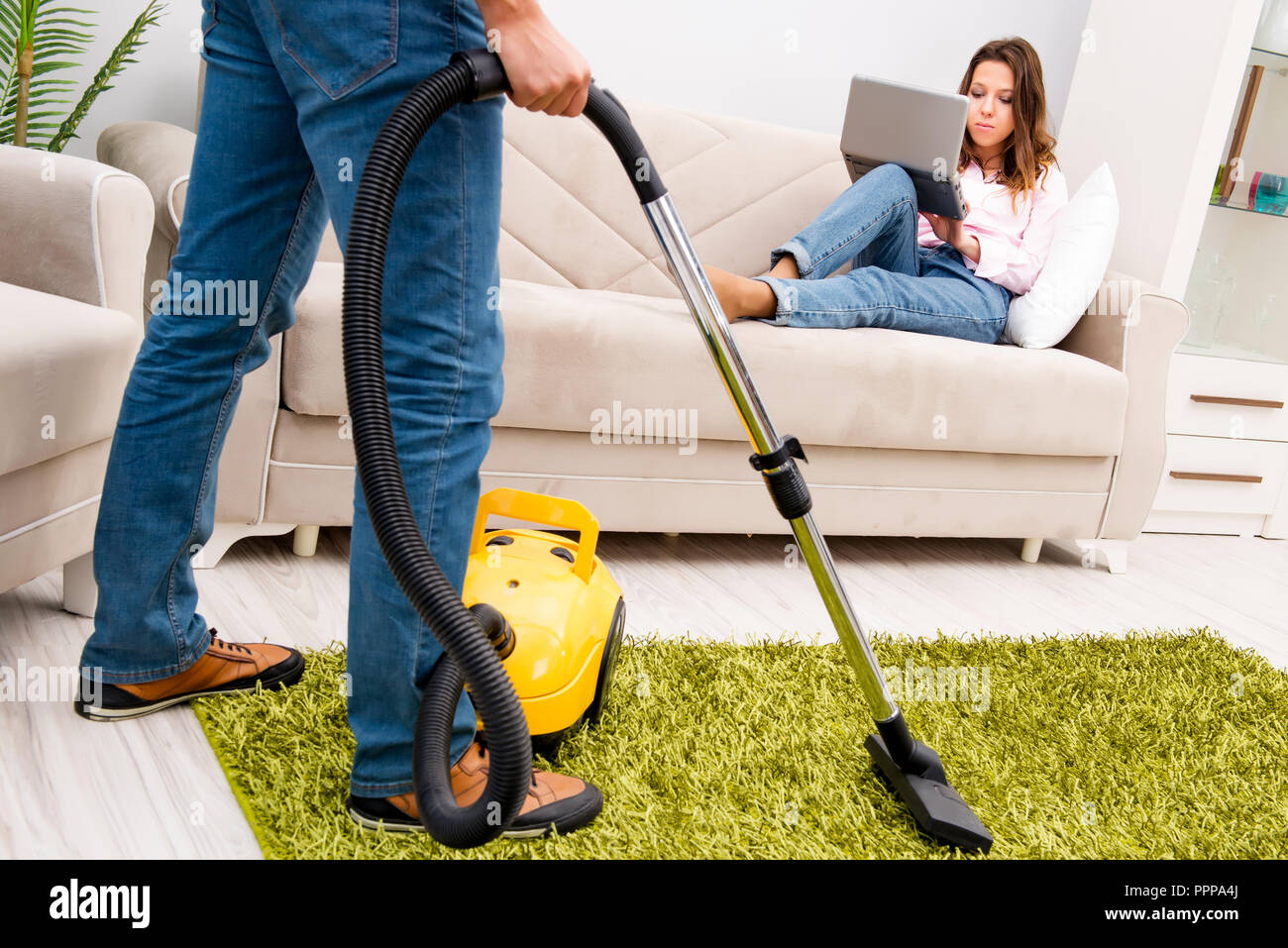 Cleaning the house with vacuum cleaner Stock Photo Alamy