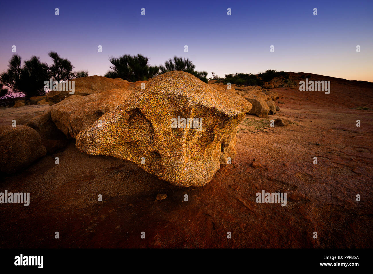 Erosion leaving large granite rock on top of Elachbutting Rock Western Australia Stock Photo