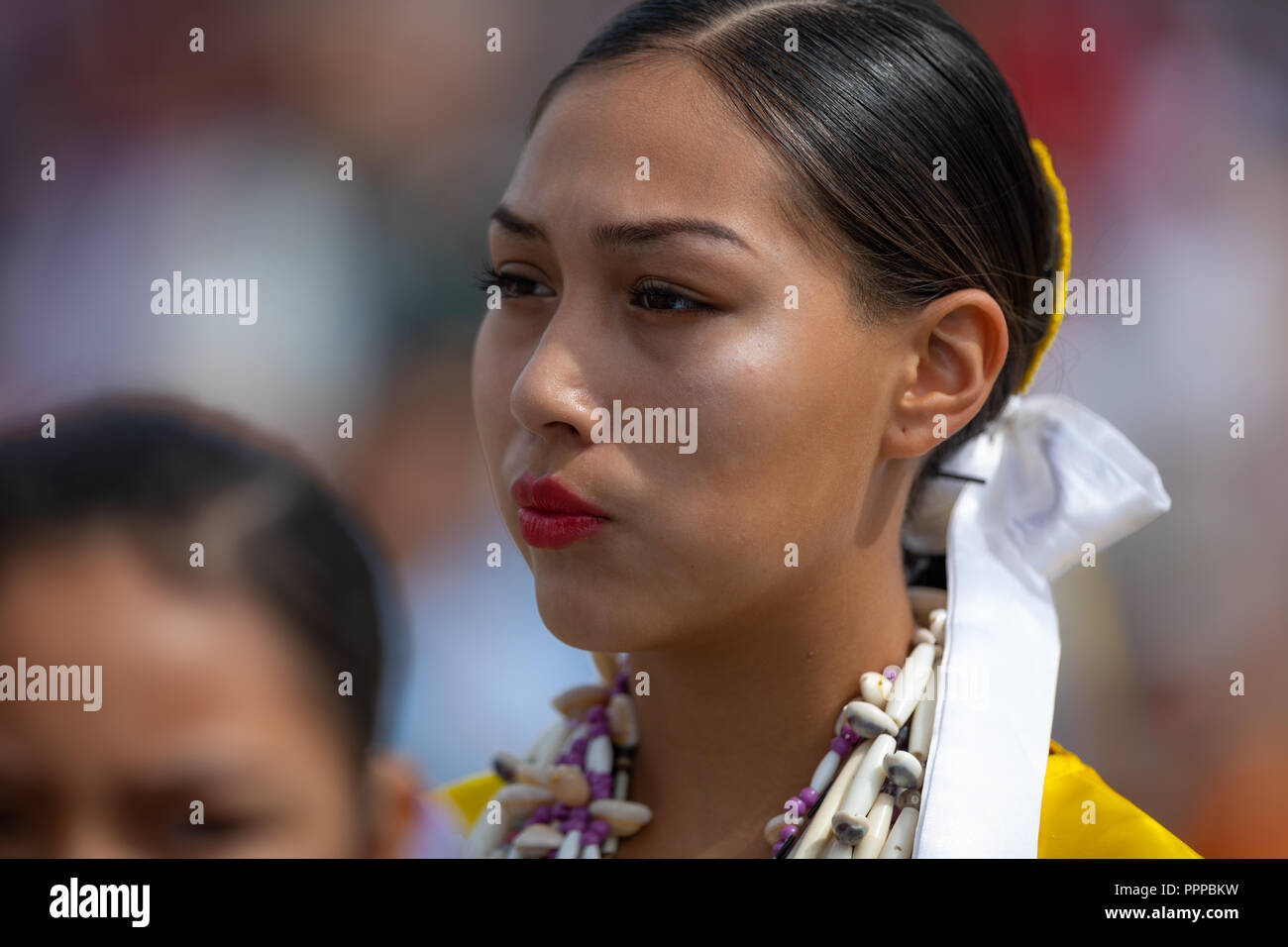 Milwaukee, Wisconsin, USA - September 8, 2018 The Indian Summer Festival Young woman wearing traditional native american clothing at the pow wow compe Stock Photo