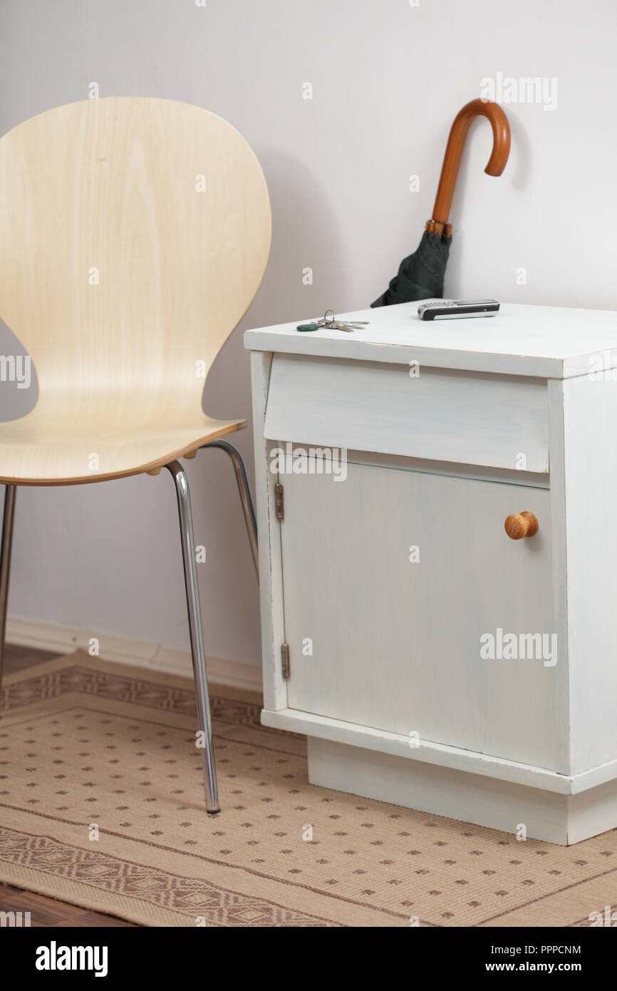 Chest and chair in interior of hallway Stock Photo Alamy