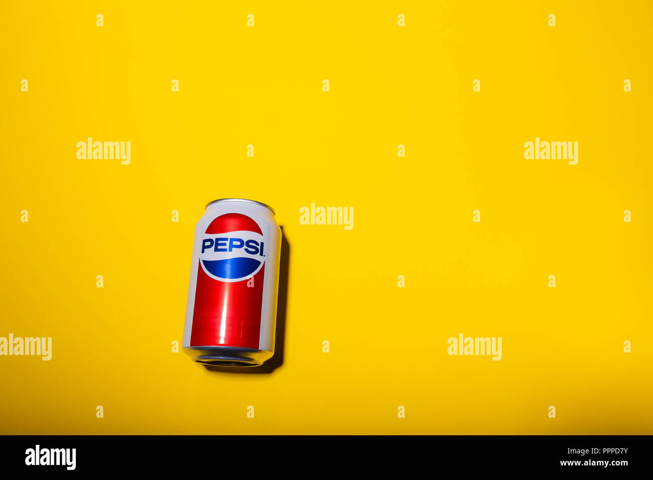 JONISKIS, LITHUANIA: 20th September - A can of new design pepsi drink isolated on yellow background Stock Photo