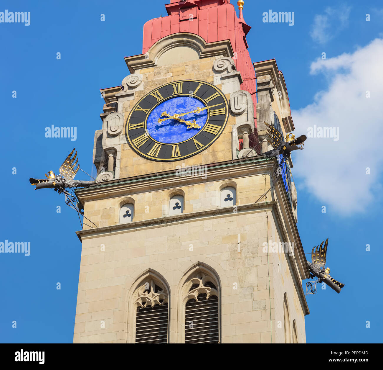 Partial view of one of two towers of the City Church of Winterthur (German: Stadtkirche Winterthur) in Switzerland against blue sky. Stock Photo