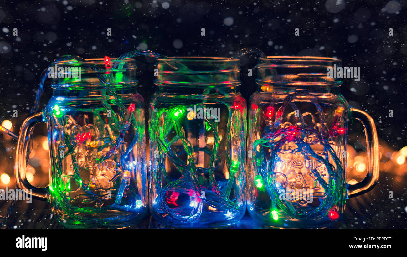 colorful lights in glass transparent jar snow Christmas lights in the